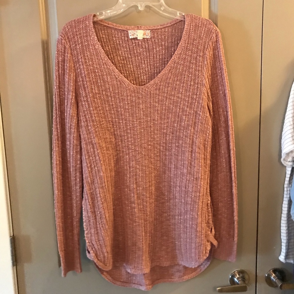 Pink knit sweater with criss-cross side/bottom